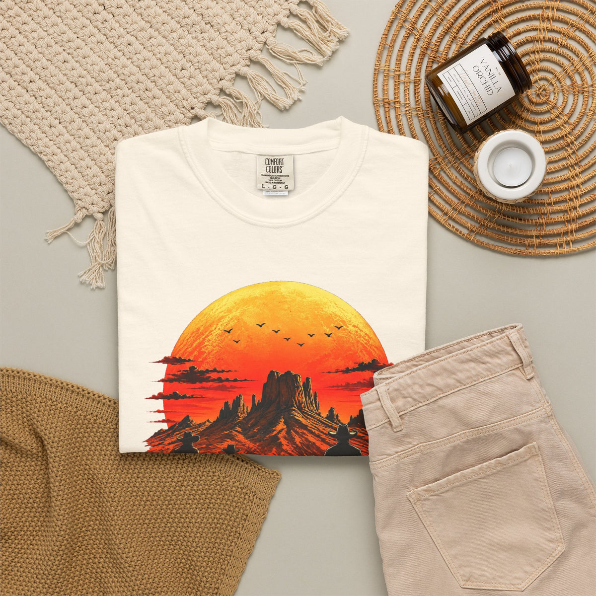Ivory Western Sunset Riders graphic tee in neutral flat-lay styling