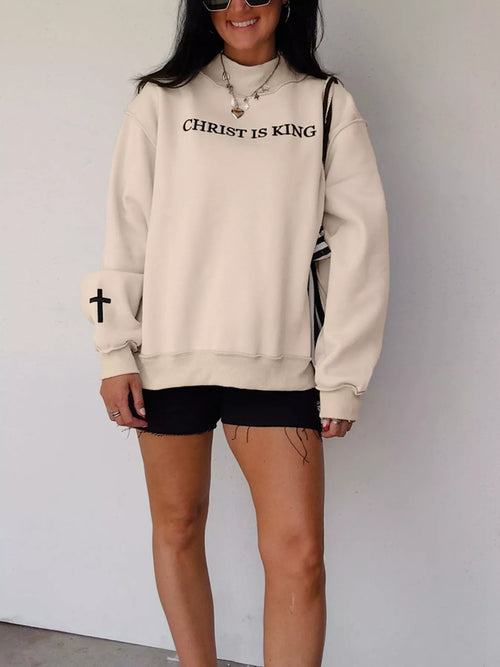 Christ Is King Embroidered Sweatshirt – Beige in Beige styled on model